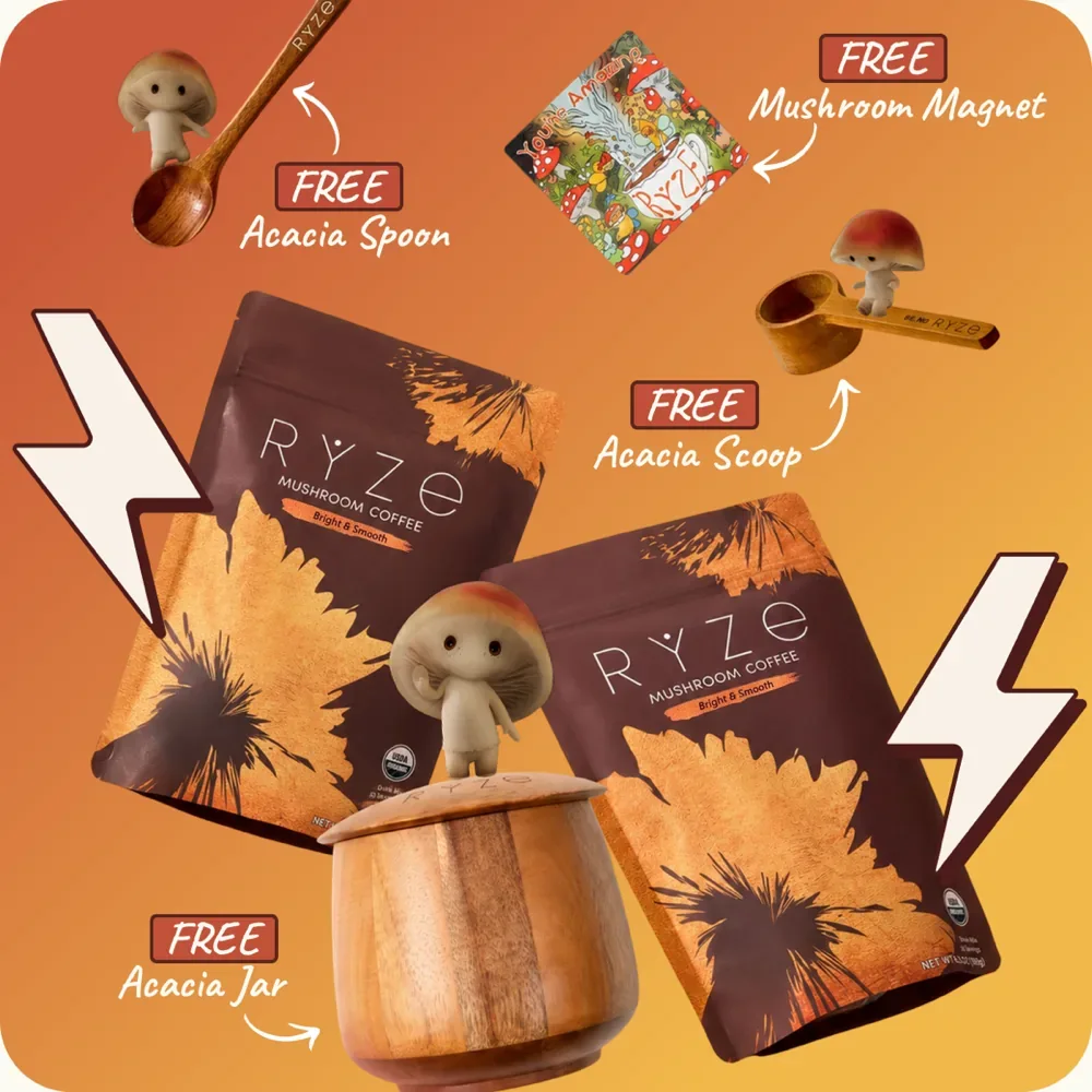 Two RYZE Mushroom Coffee bags surrounded by the free gifts — acacia spoon, scoop, jar, and mushroom magnet, each tagged FREE.