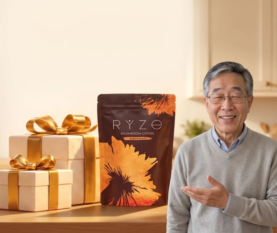 UP TO 40% OFF + FREE GIFTS. RYZE coffee and gift boxes with the older man in the grey sweater standing in the foreground of his kitchen.