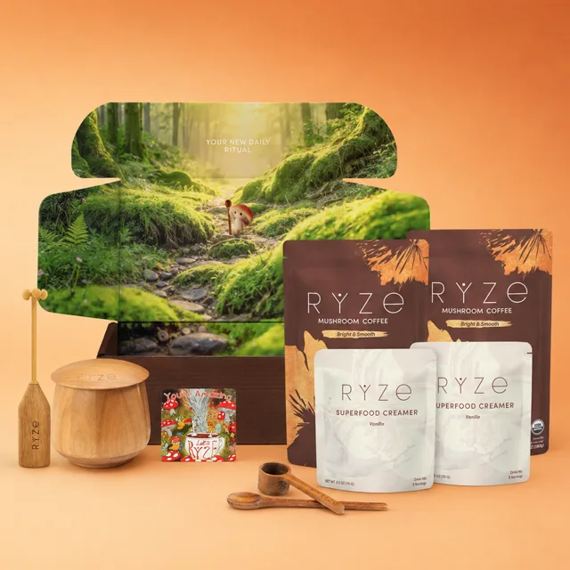 The RYZE Ritual Set — two bags of mushroom coffee, two vanilla creamers, acacia jar, frother, spoon and scoop in an open gift box