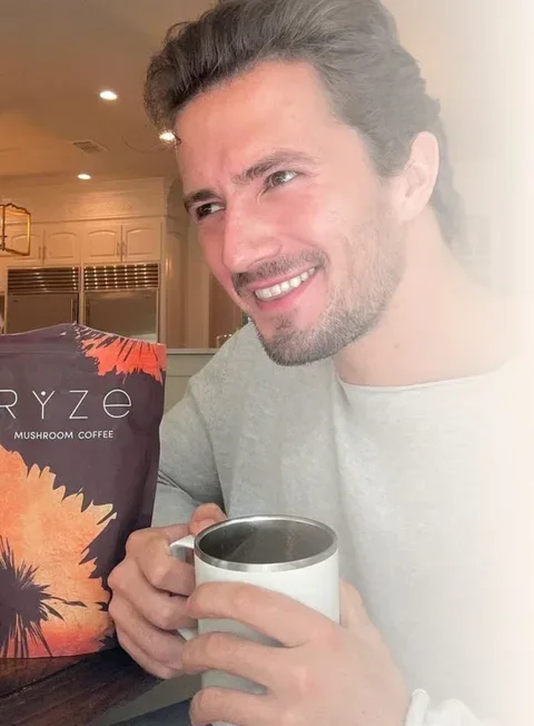 Adam sipping his RYZE coffee