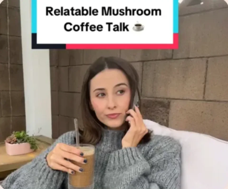 Creator video: “Relatable Mushroom Coffee Talk”, holding an iced RYZE