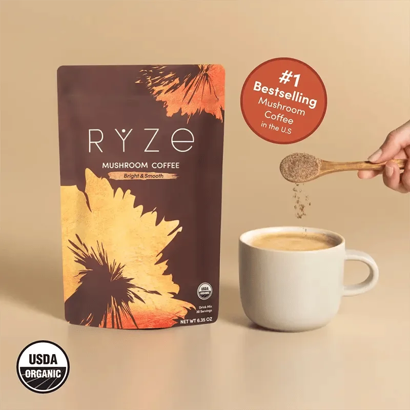 RYZE Mushroom Coffee pouch beside a prepared cup