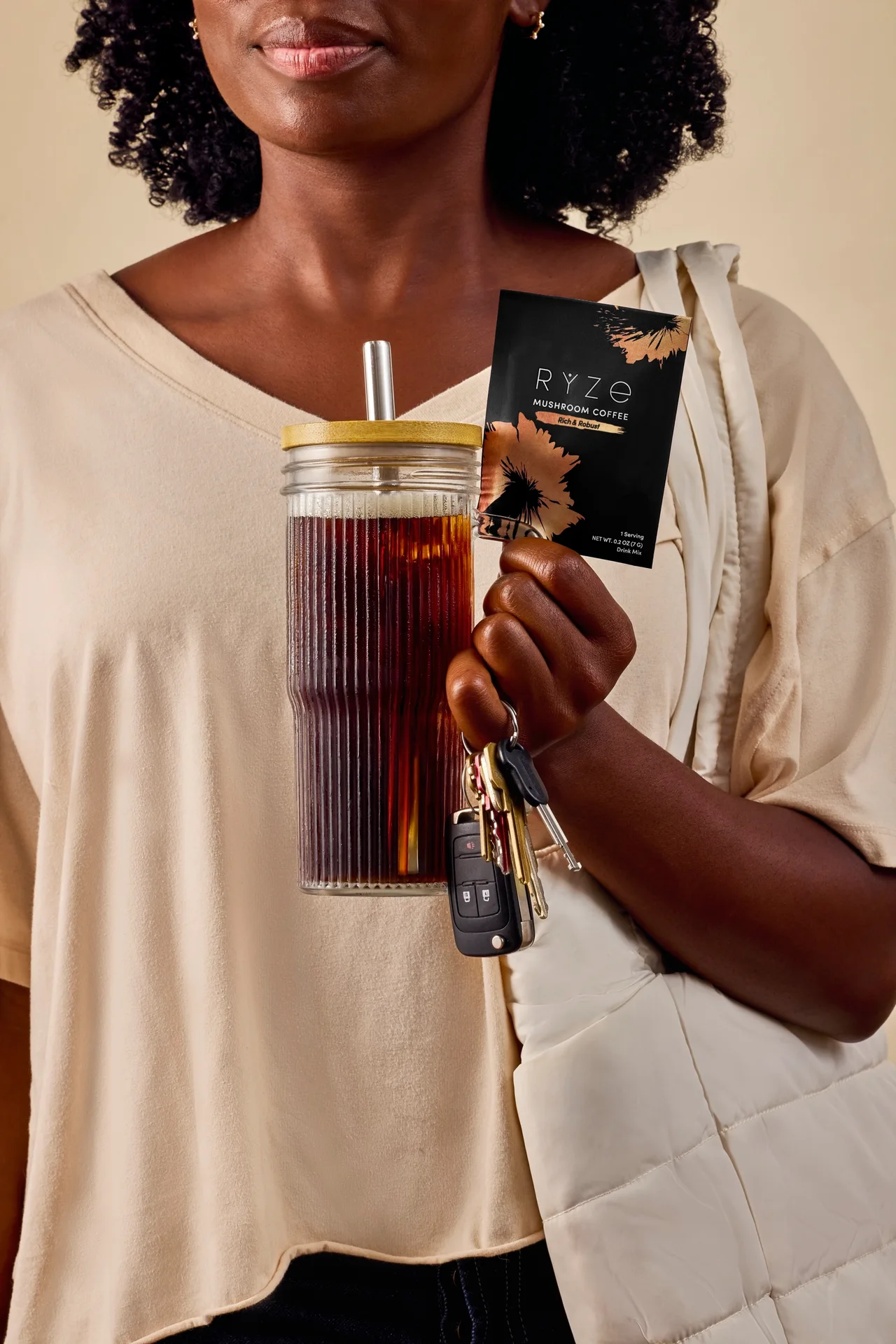 Iced RYZE mushroom coffee in a glass tumbler, grabbed on the way out the door
