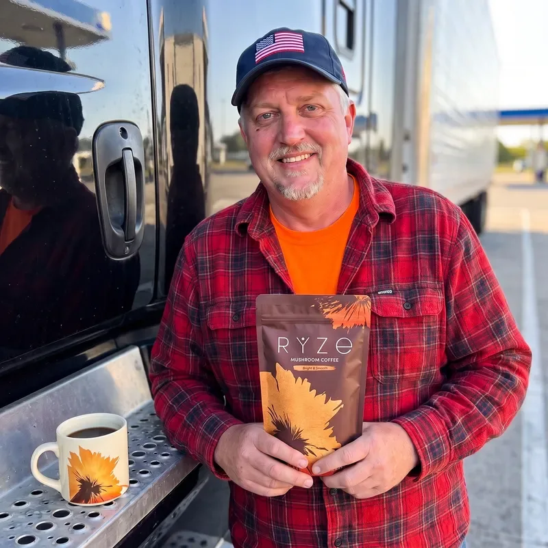 The truck driver from the ad holding the full brown Bright & Smooth pouch beside the approved cream RYZE mug.
