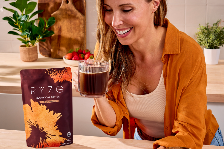 Brenda holding a mug of RYZE