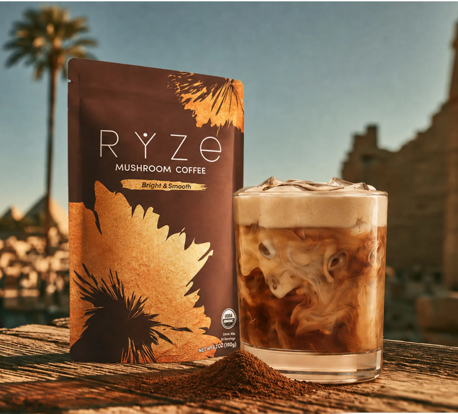 RYZE Mushroom Coffee pouch beside an iced latte on a wooden table